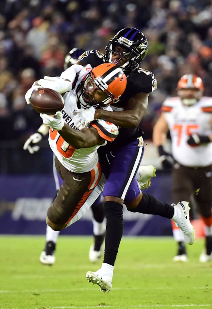 Browns wide receiver Jarvis Landry (80) cannot catch a pass while being defended by Ravens cornerback Tavon Young (25) at M&T Bank Stadium in Baltimore, Dec. 30, 2018.